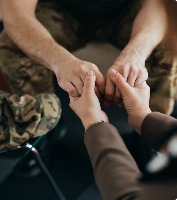 Veteran's hands clasped for comfort.